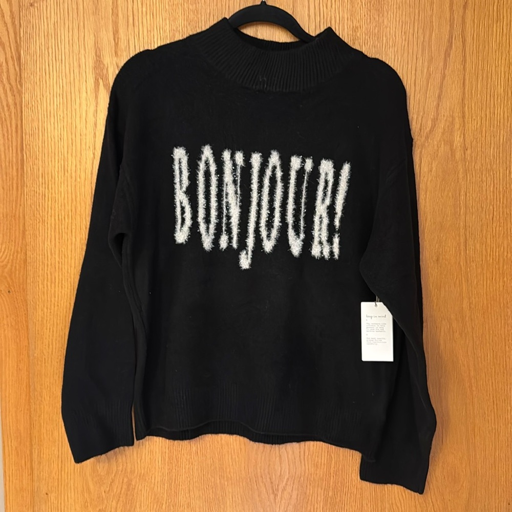 Brand new crew neck sweater with the French word BONJOUR!
